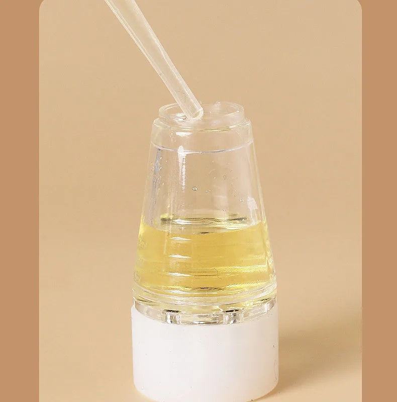 Applicateur d'huile pour cuir chevelu